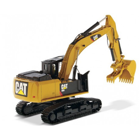 Pelle forestière Caterpillar 568 avec figurine