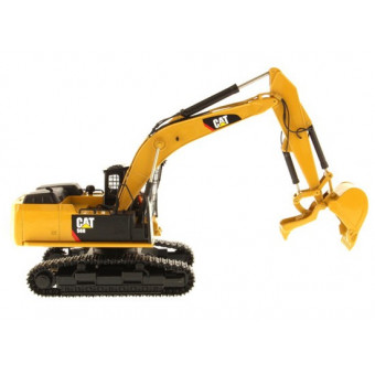 Pelle forestière Caterpillar 568 avec figurine