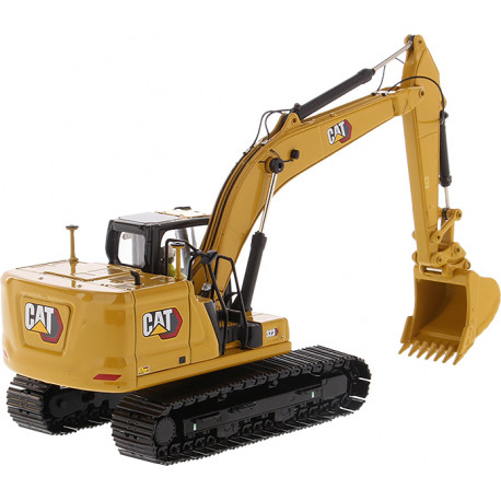 Pelle hydraulique Caterpillar 323 avec figurine